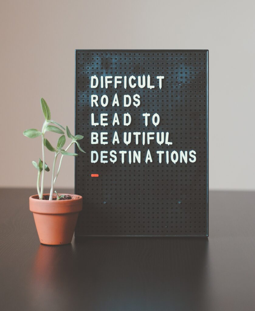 photo image of sign: difficult roads lead to beautiful destinations
